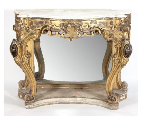 A 19th Century carved giltwood serpentine console table, the shaped top with moulded edge above a scrolling frieze, on moulde