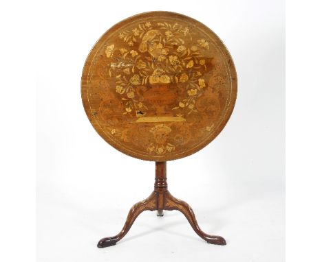 A 19th Century Dutch walnut tripod table, the top extensively inlaid with an urn of flowers above a mask head with scrolls, o