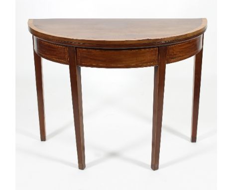 A 19th Century mahogany and crossbanded demi-lune card table, the fold over top with baize interior set on square tapering le