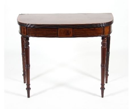 A Regency mahogany D-shaped card table, the crossbanded foldover top above an inlaid frieze on turned tapering legs, 92cm wid