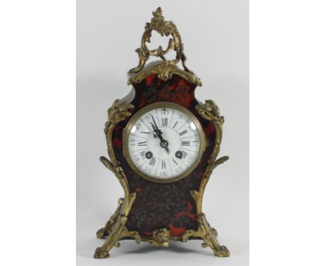 A 19th Century boulle type mantel clock in a tortoiseshell and brass inlaid case fitted an eight-day striking movement No1520