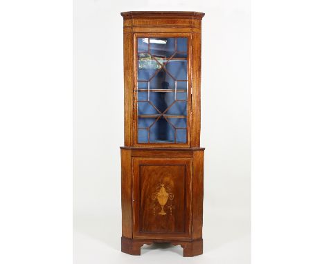 A Regency mahogany corner display cabinet, the top section with astragal glazed door above a single panel door with urn inlay