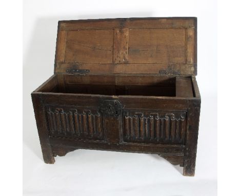 An oak coffer with single panel top and linen fold front, 116cm wide