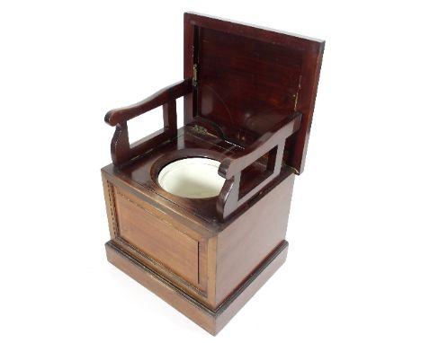 A Victorian mahogany box commode, the hinged cover enclosing arm rests, a hinged seat and ceramic pot, 55cm wide