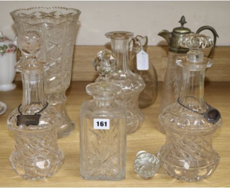 A collection of continental glass decanters, claret jug with plated mount, a decanter and a cut glass vase