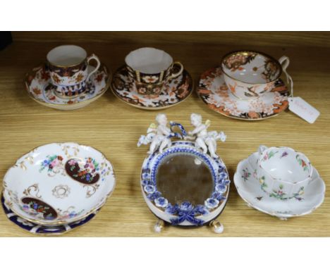 A Dresden floral encrusted cup and saucer, a quantity of Royal Crown Derby teaware and a Sitzendorf wall mirror