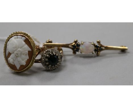 An 18ct gold, sapphire and diamond cluster ring, a 9ct gold cameo ring and a 9ct gold, white opal and sapphire bar brooch.