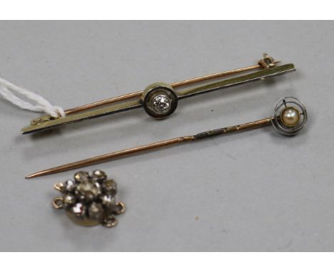 A yellow metal and diamond set bar brooch, a stick pin, and a rose cut diamond set clasp.