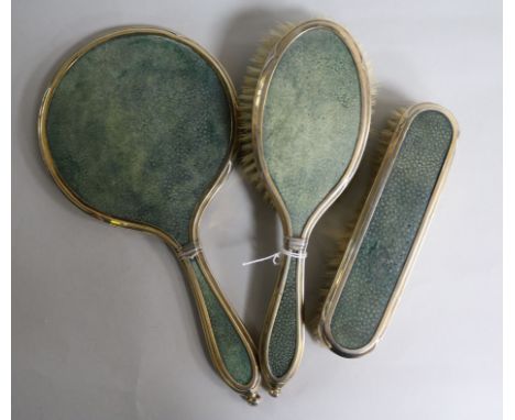 A George V silver and shagreen mounted three piece mirror and brush set by Charles & Richard Comyns, London, 1926.