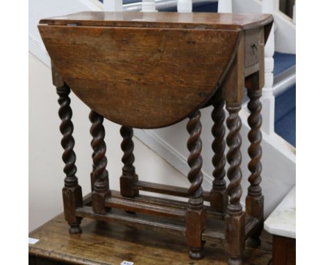 A small early 18th century oak oval topped gate leg table W.64cm