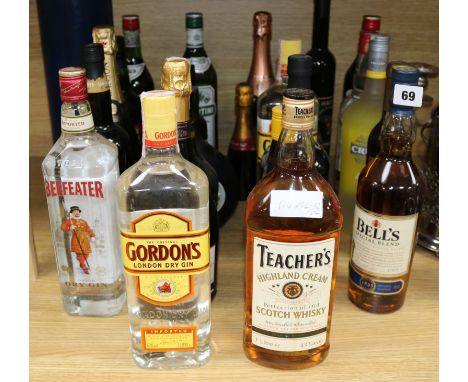 Twenty four assorted spirits and wines, including Scotch, Gin, Banana Rum, Champagne and Sherry.