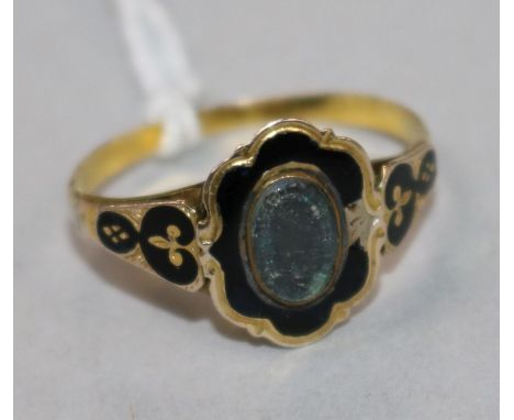 A 19th century gold and black enamel mourning ring, size Q.