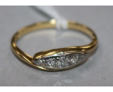 An 18ct gold and five stone diamond ring, size K.