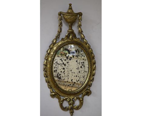 A late 18th/early 19th Century gilt wall mirror W.30cm