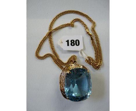 A Rare 366ct Cushion Cut Blue Topaz on 9ct Gold Claw mount and 9ct Gold fancy link chain, total 95g total weight inc Topaz 