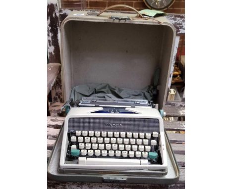 PORTABLE OLYMPIA TYPEWRITER IN CARRY CASE