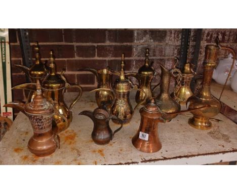 SHELF OF MIDDLE EASTERN TEA POTS