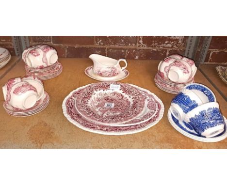 SHELF WITH RED & WHITE CUPS & SAUCERS, OLD BRITAIN CASTLES BY JOHNSON BROTHERS, BLUE & WHITE CUPS & SAUCERS BY ADAMS & OTHER 