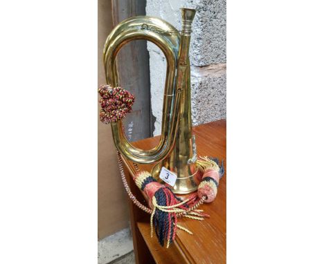 BRASS BUGLE WITH A ROYAL ARTILLERY BADGE BUGLE WITH SLIGHT DENTS