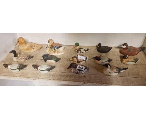 SHELF OF DUCK ORNAMENTS