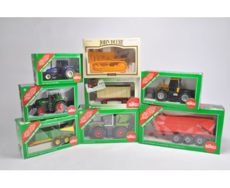 Large Siku Farm Group including Tractor and Implement Models. Generally Near Mint in Very Good Boxes. (8)
