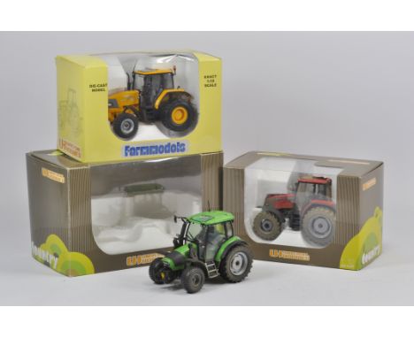 Trio of Universal Hobbies Tractor Models including McCormick x 2 and Deutz. Some modifications. Near Mint with Boxes. (3)