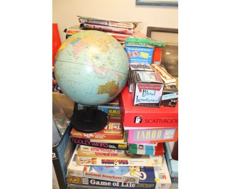 A LARGE QUANTITY OF BOARD GAMES, TO INCLUDE MONOPOLY, GUESS WHO? SPACE ATTACK, TOGETHER WITH A GLOBE, ETC