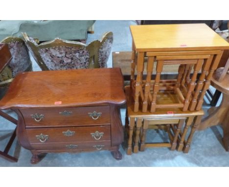 A small serpentine bombe commode chest of recent manufacture and two nests of occasional tables