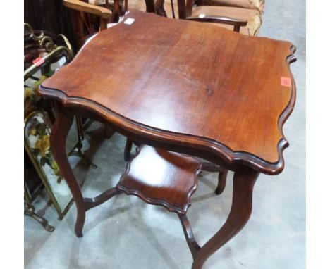 An Edwardian mahogany centre table, a brass triptych mirror firescreen and an oval wall mirror