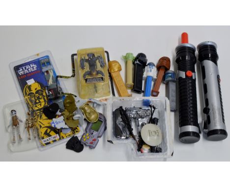 STAR WARS INTEREST - LOT COMPRISING A BOXED LCD WATCH, 2 TOY LIGHT SABRES, 6 VARIOUS SWEETIE DISPENSERS, VARIOUS NOVELTY RING