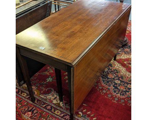 19th Century mahogany gate action double drop leaf dining table with ebony strung outlines on square tapering legs. 120 long 