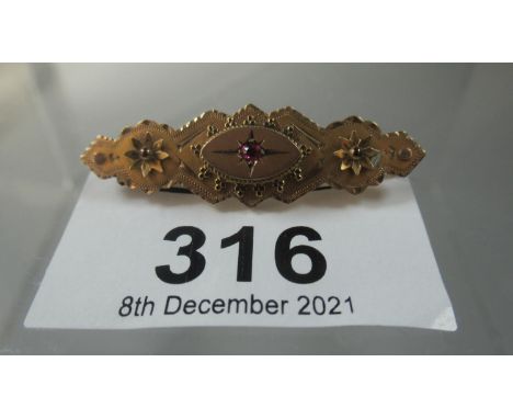 9ct gold bar brooch set to the centre with a ruby.  Approx weight 1.9 grams.(B.P. 21% + VAT) 