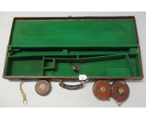 Vintage tan leather gun case, the interior revealing three vintage leather and brass measuring tapes. (B.P. 21% + VAT)