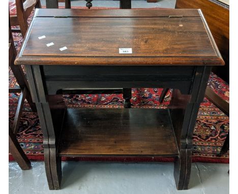 Mahogany low devotional desk with trestle ends and under shelf below a hinged sloped front. 60cm wide approx. (B.P. 21% + VAT