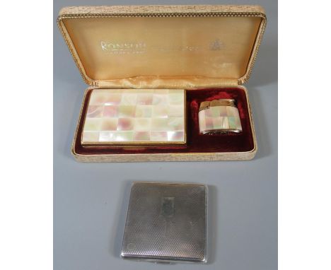 Art Deco silver engine turned compact, together with another vintage gold finish and mother of pearl compact and a mother of 