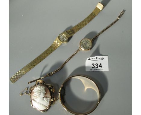 9ct gold wristwatch with 9ct strap. Approx weight 14.4 gram  Cameo brooch, bangle etc.(B.P. 21% + VAT) 