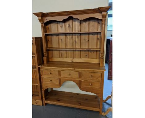 Modern natural pine Welsh pot board dresser with boarded two shelf rack, having half turned pilasters, the base with an arran