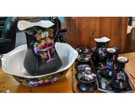 Staffordshire pottery black ground fruit decorated jug and basin set, to include; jug, bowl, two chamber pots, dressing table