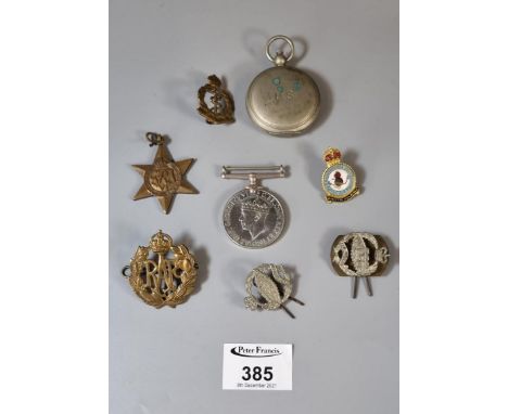 Queen Elizabeth tin box, the interior revealing; cap badges, chrome plated compass marked US, 1939-45 unnamed War and Star me