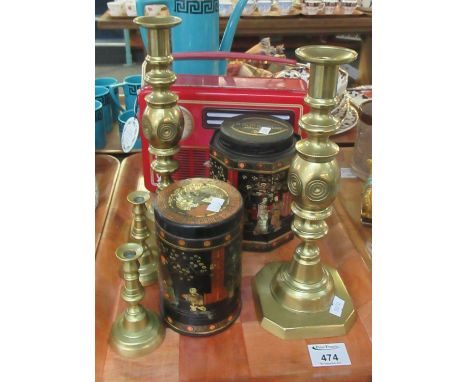 Tray of assorted metalware to include; two full size and two miniature brass candlesticks, two oriental design tea tins; one 