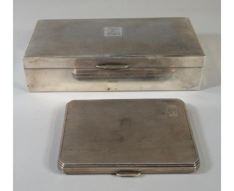 Silver engine turned cigarette box marked Marke-wood prize 1936, together with an engine turned Art Deco design silver cigare