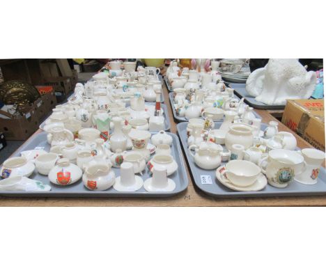 Six trays of W.H Goss crested ornamental china to include: a model of a Carmarthen coracle, a model of the first shoe worn by