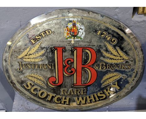 An oval printed advertising mirror with bevel plate, for Justerini &amp; Brooks, J &amp; B rare Scotch whisky, unframed. 39 x