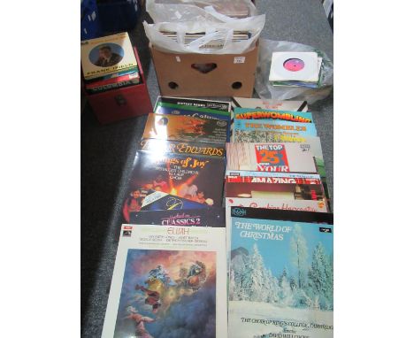 Box of assorted LP and single vinyl records, an eclectic collection including: stand up comedians, Christmas carols, pop reco