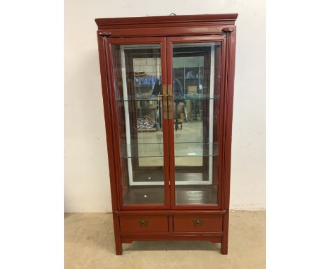 An oriental lacquered mirrored back display cabinet with two glass shelves with light to top. W:93cm x D:49cm x H:180cm