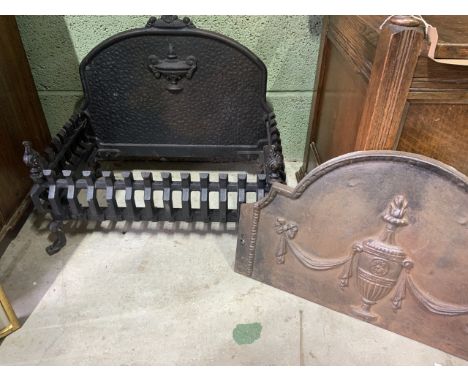 A heavy cast iron fire grate - no base also with a decorative fire back. W:55cm x D:30cm x H:45cm