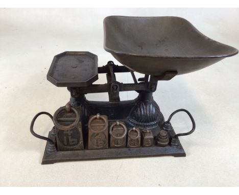 A set of Edwardian scales and weights mounted on tray W:32cm x H:26cm 