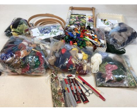 A large quantity of tapestry wool and embroidery yarn also with tapestry frames and knitting needles. 