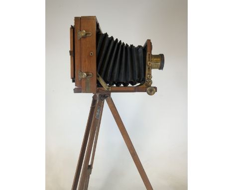 A Lancaster and Son Birmingham 1891 instantograph patent camera on tri pod stand. Lens marked J Lancaster and sons also with 