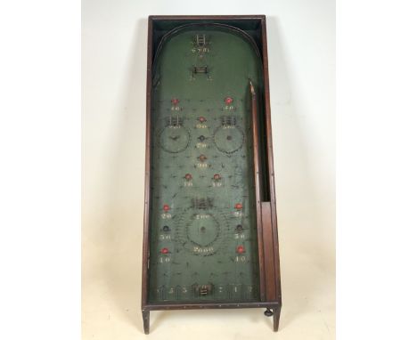 A large antique bagatelle board. Stained pine frame. Original paintwork. W:50cm x D:11cm x H:129cm